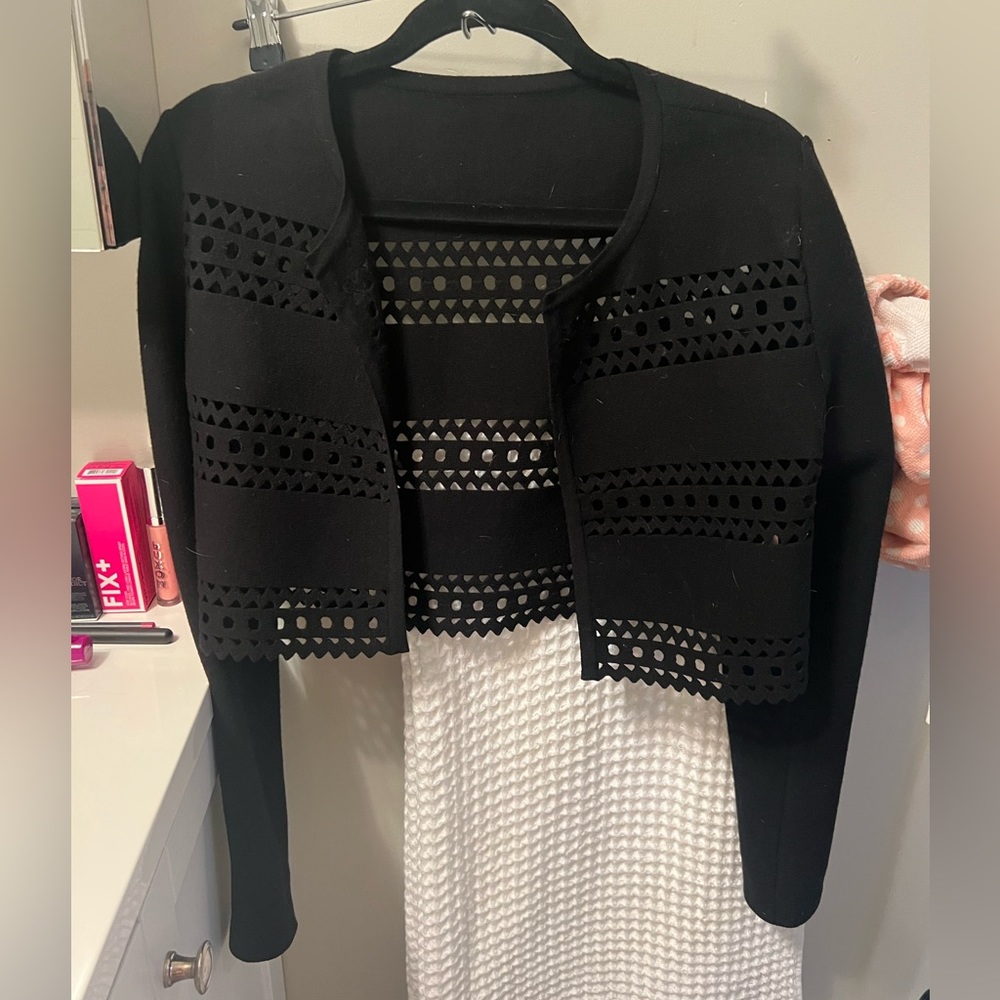 Alaia shrug.